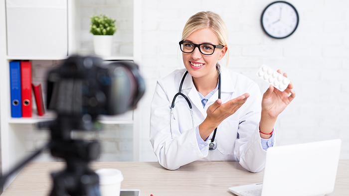 Doctor shows product to the camera