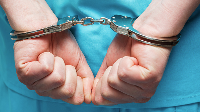 handcuffed doctor
