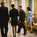 Business People Walking by Window