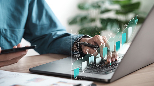 Statistics of the industry displayed in front of laptop